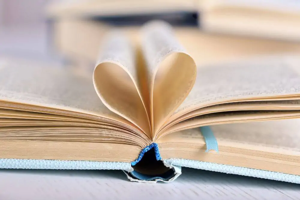 Pages of book curved into a heart shape, close up